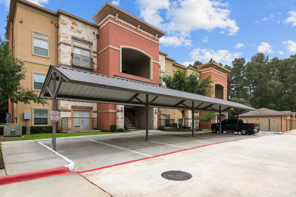 Community view with parking shed at The Loop in Conroe, Texas