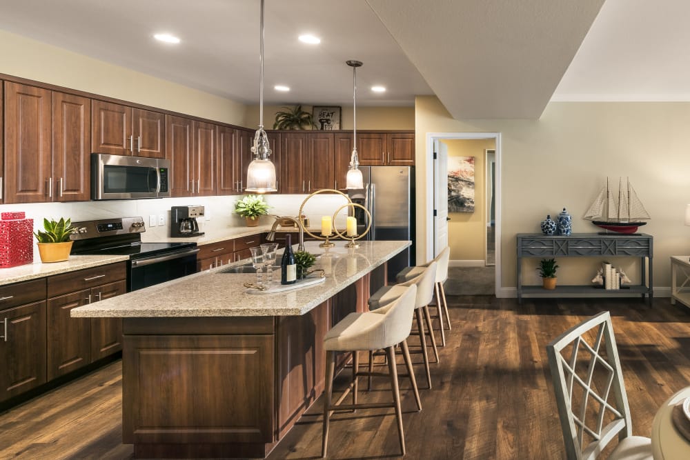 Modern kitchen with granite countertops and custom cabinetry at San Portales in Scottsdale, Arizona