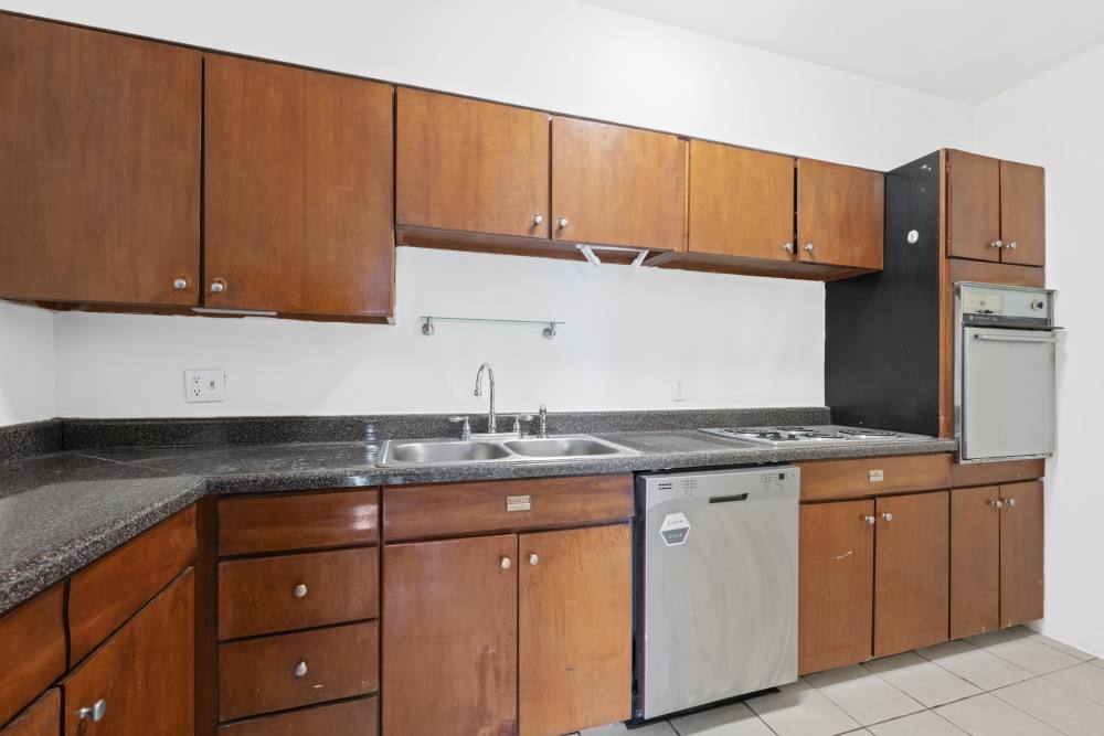 Kitchen with wooden cabinetry at Central Gardens in Memphis, Tennessee