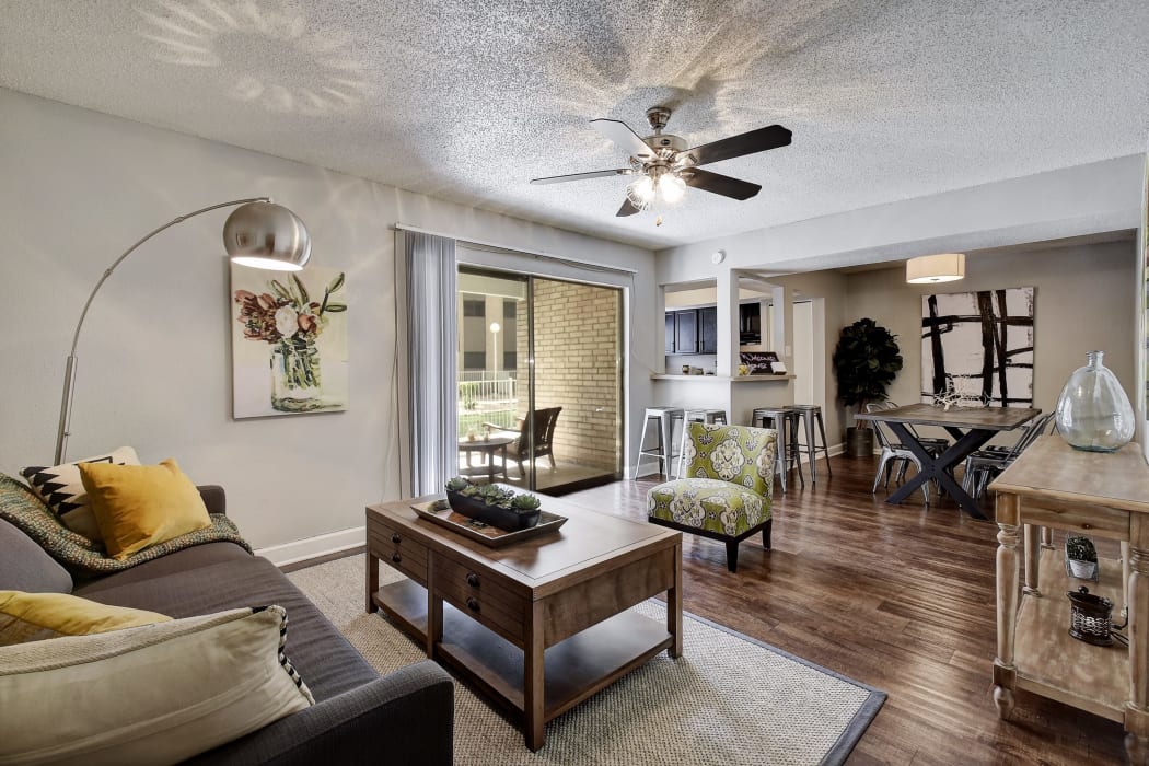 Beautiful apartment interior with hardwood flooring at Oasis at Oakwell in San Antonio, Texas