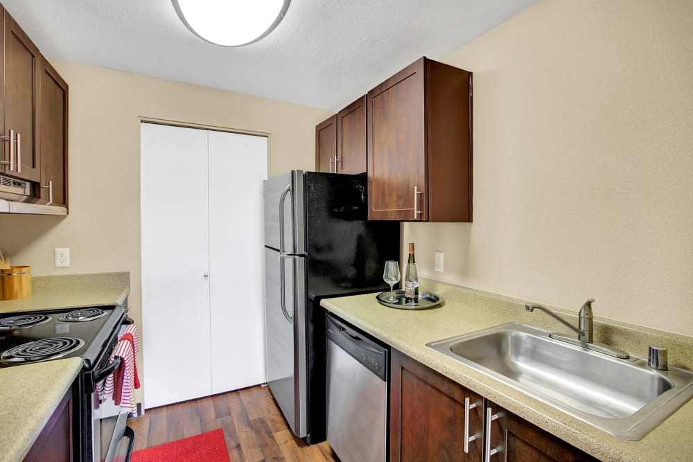 A kitchen with plenty of cabinet space at Waters Edge Apartments in Kent, Washington