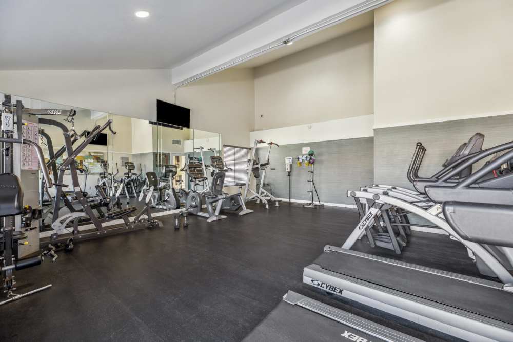 Fitness center with cardio equipment at Portofino Townhomes in Wilmington, California