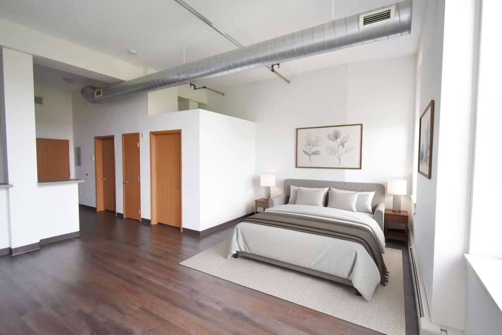 Wooden doors and wall art in bedroom at Straus Lofts in Saint Paul, Minnesota