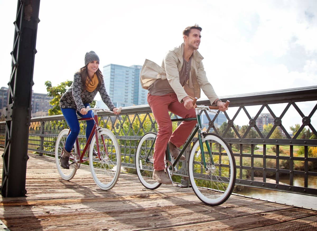 Residents biking near Rippling Stream Townhomes in Durham, North Carolina