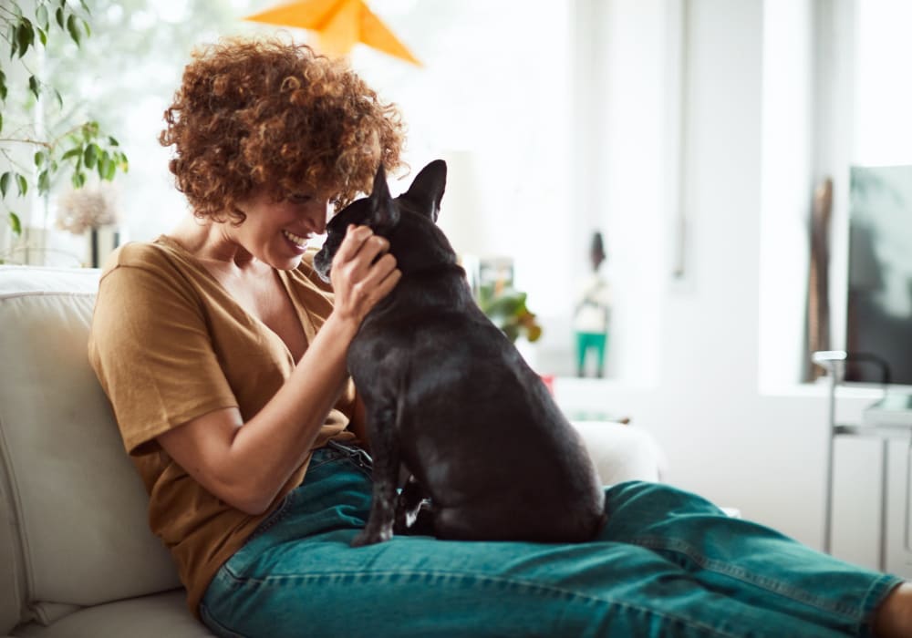 Resident hugging her dog near Autumn Chase in Bothell, Washington