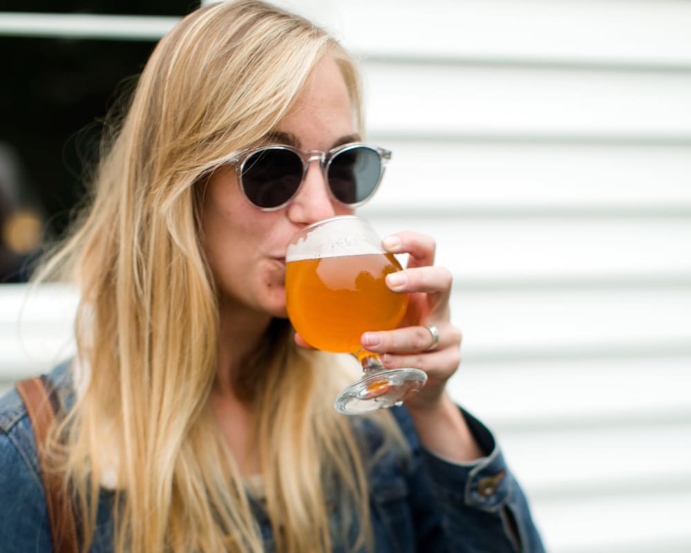 Resident enjoying a Northwest craft brew at Sofi at Forest Heights in Portland, Oregon