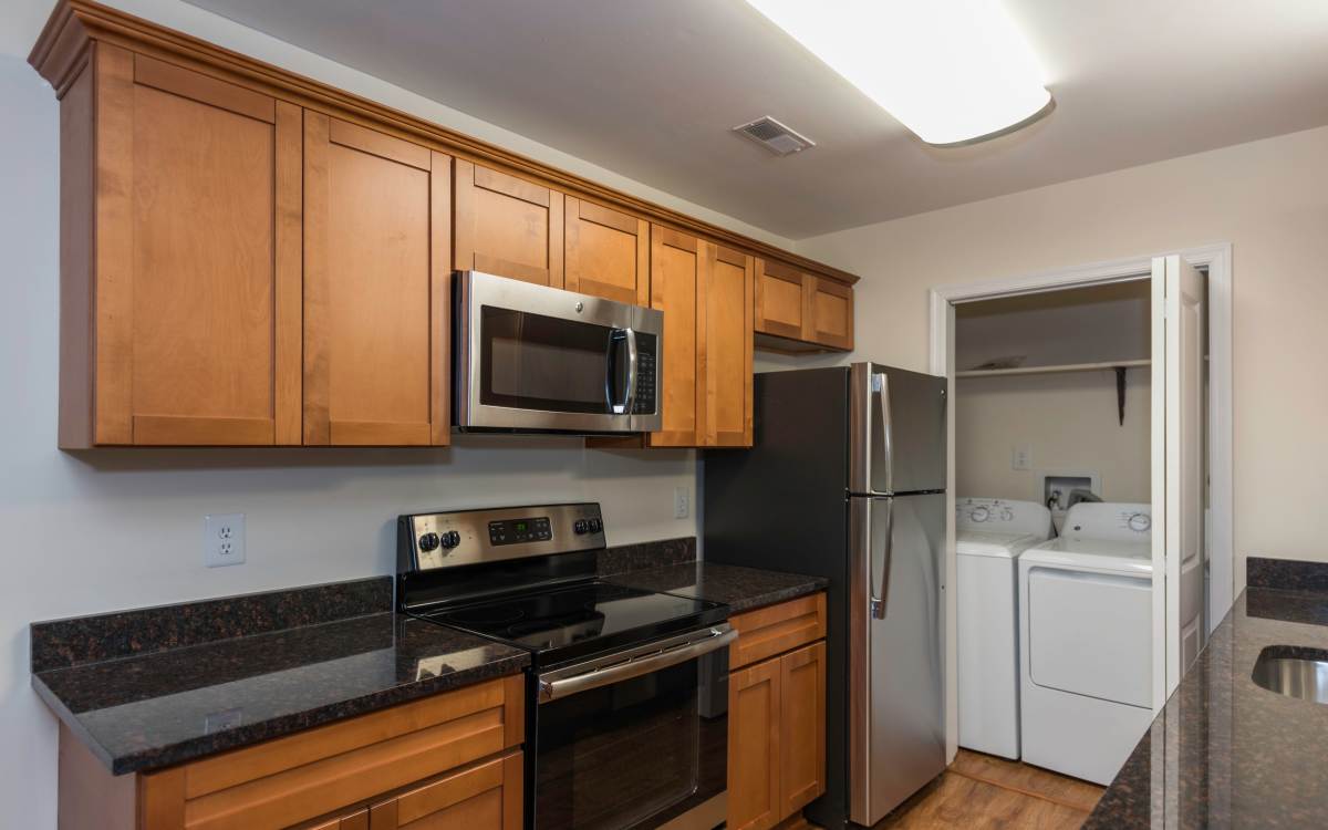 Apartment kitchen with stainless-steel appliances at Fox Chase Apartments in Fredericksburg, Virginia