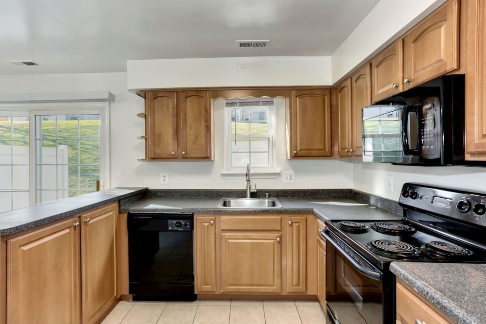 Model kitchen with granite countertops at Olde Forge Townhomes in Perry Hall, Maryland