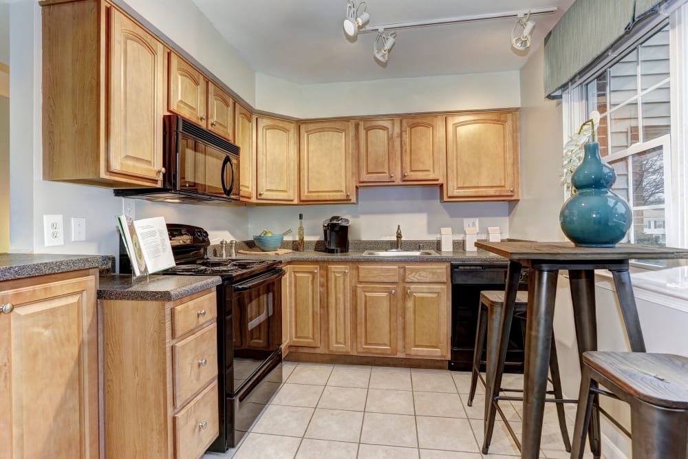Model kitchen and dining table at Olde Forge Townhomes in Perry Hall, Maryland