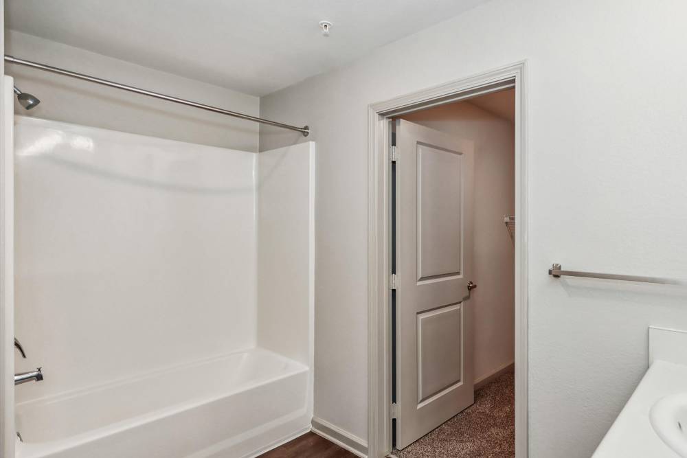 Bathroom showing a bath tub at Flats at Mount Zion in Stockbridge, Georgia