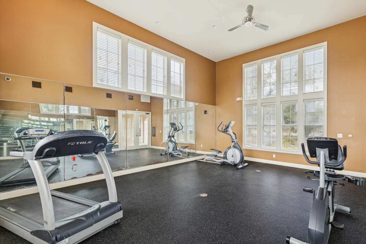 Resident working out in the fitness center at Costa Vizcaya in Houston, Texas