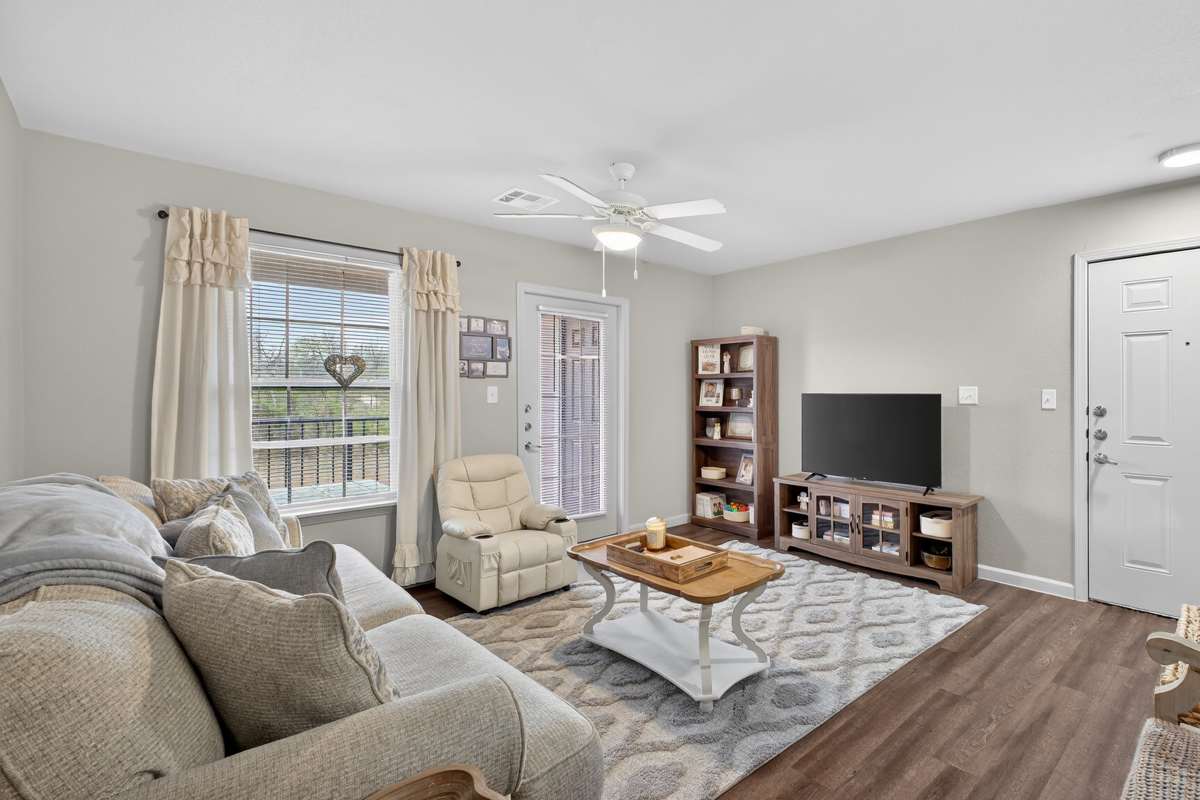 Modern living room with tv at Lakewood Crossing in Granbury, Texas