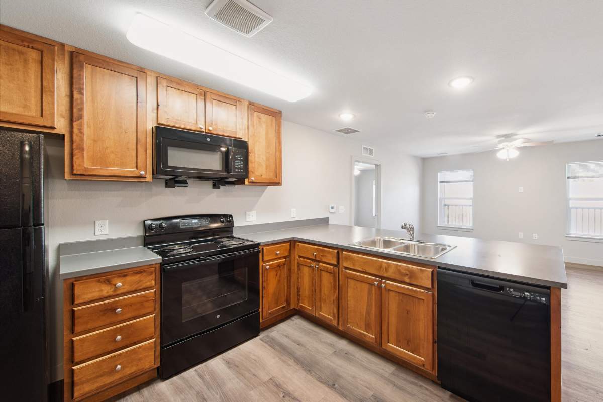 Kitchen with dishwasher at Villas At Mesa Ridge in Fountain, Colorado