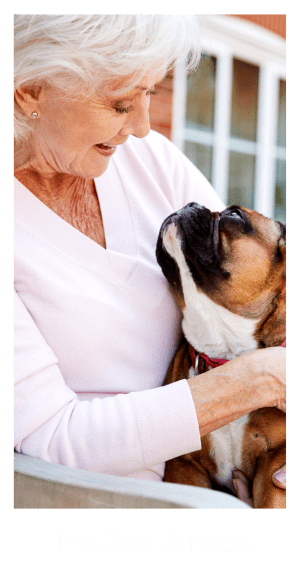 Senior resident holding her dog