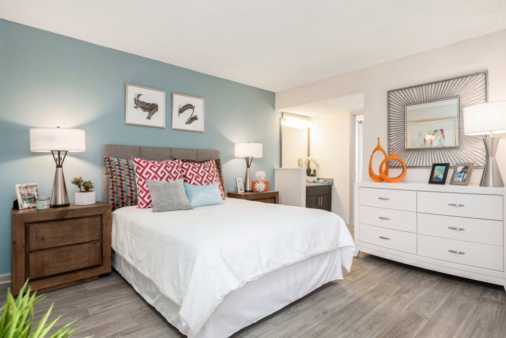 Large bedroom with wood-style floors at Siena Apartments in Plantation, Florida