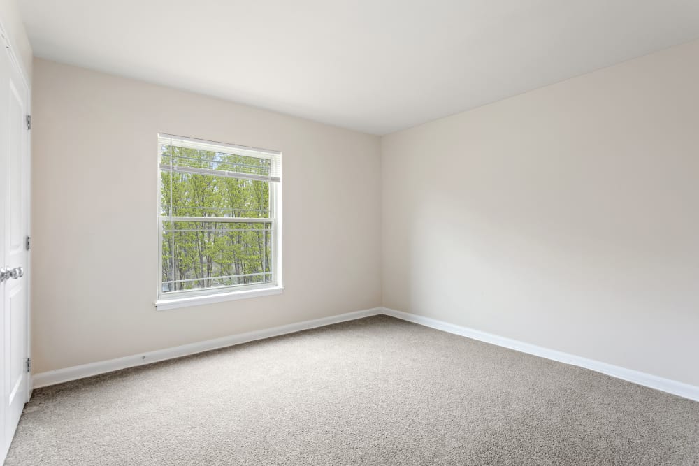 Bedroom with natural light and closet at Creekside Village in Alexandria, Virginia