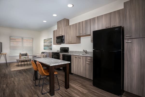 Spacious kitchen with dark cabinetry at The Concord Northside in Richmond, Virginia