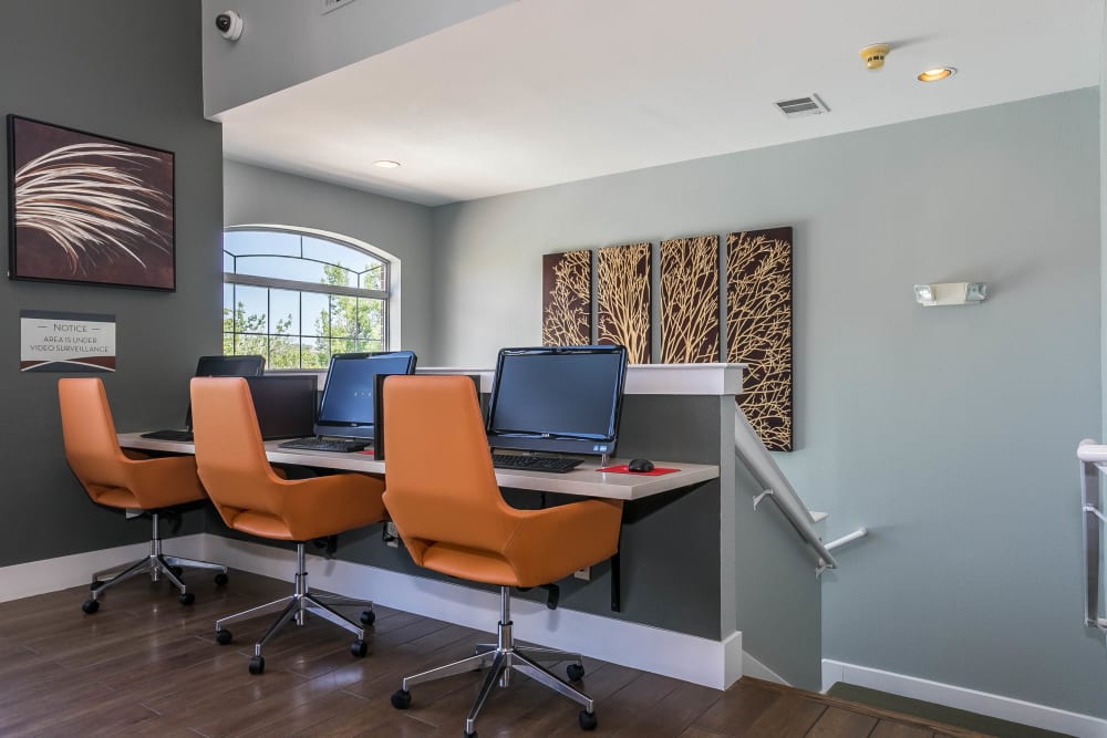 Stay connected with computers in the community business center at The Crossings at Bear Creek Apartments in Lakewood, Colorado