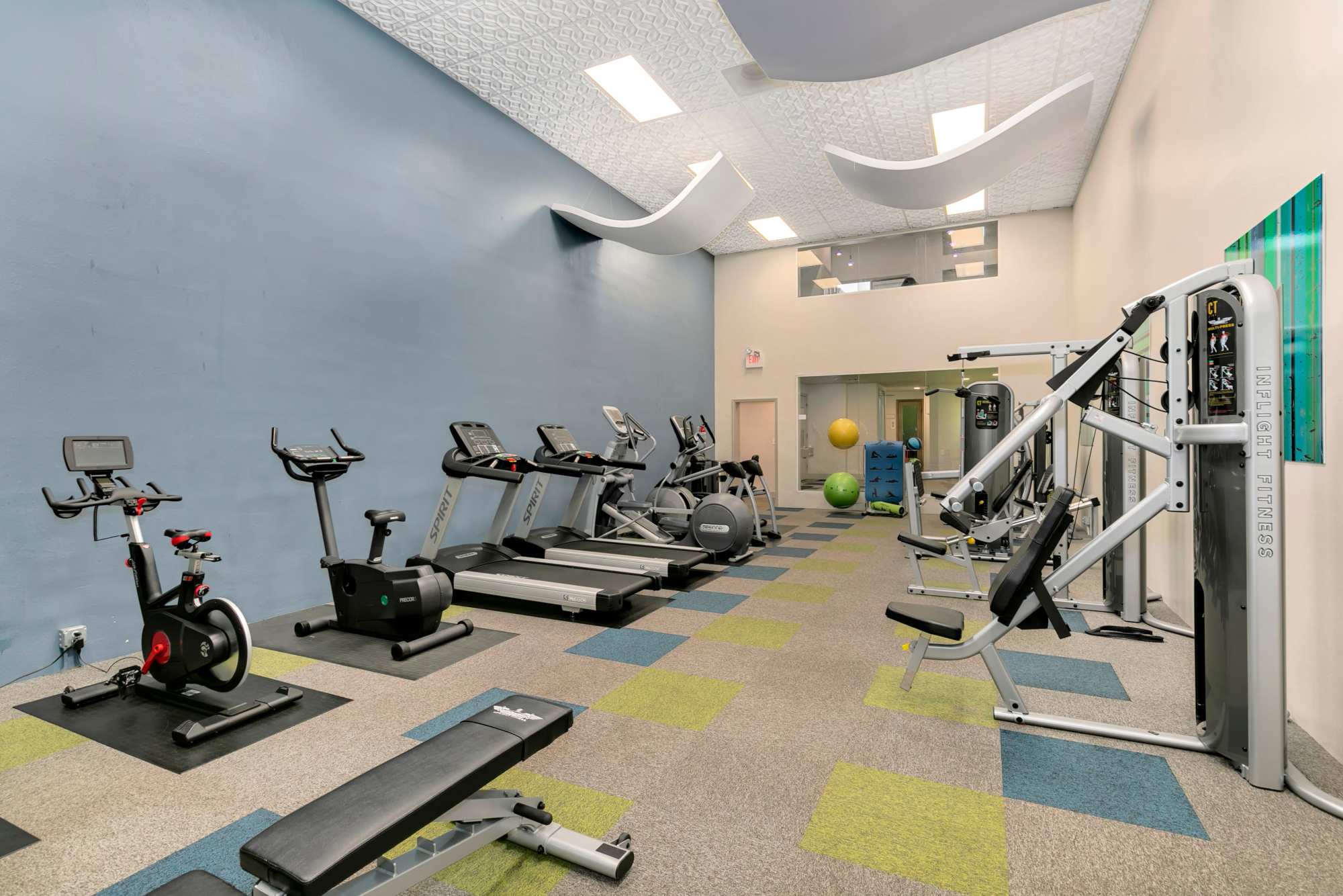 Fitness center with cardio and weight machines at Autumn Chase Apartments in Vancouver, Washington