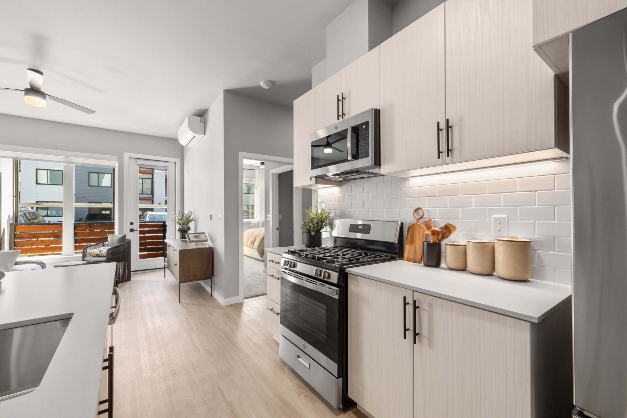 Spacious Kitchen with Island and brown cabinets at The Highlands at Silverdale in Silverdale, Washington