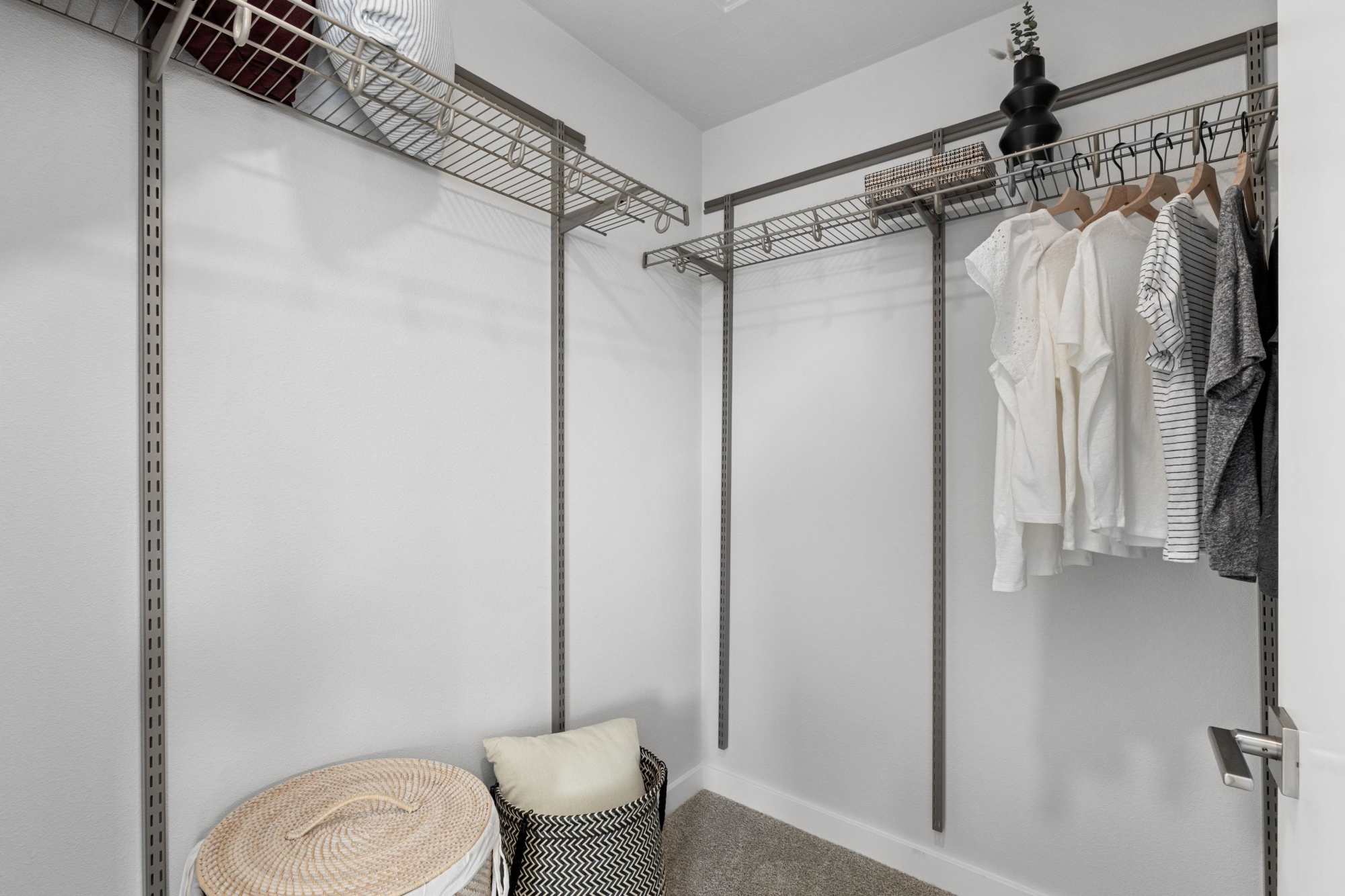 Walk-in closet with rack at The Highlands at Silverdale in Silverdale, Washington