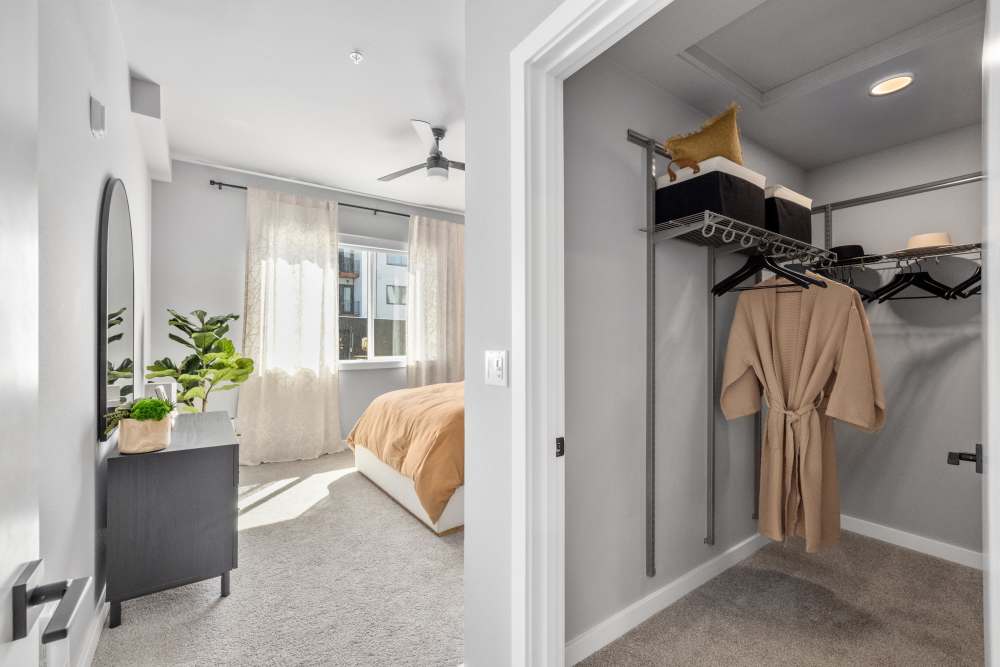Carpeted bedroom with large walk-in closet at The Highlands at Silverdale in Silverdale, Washington