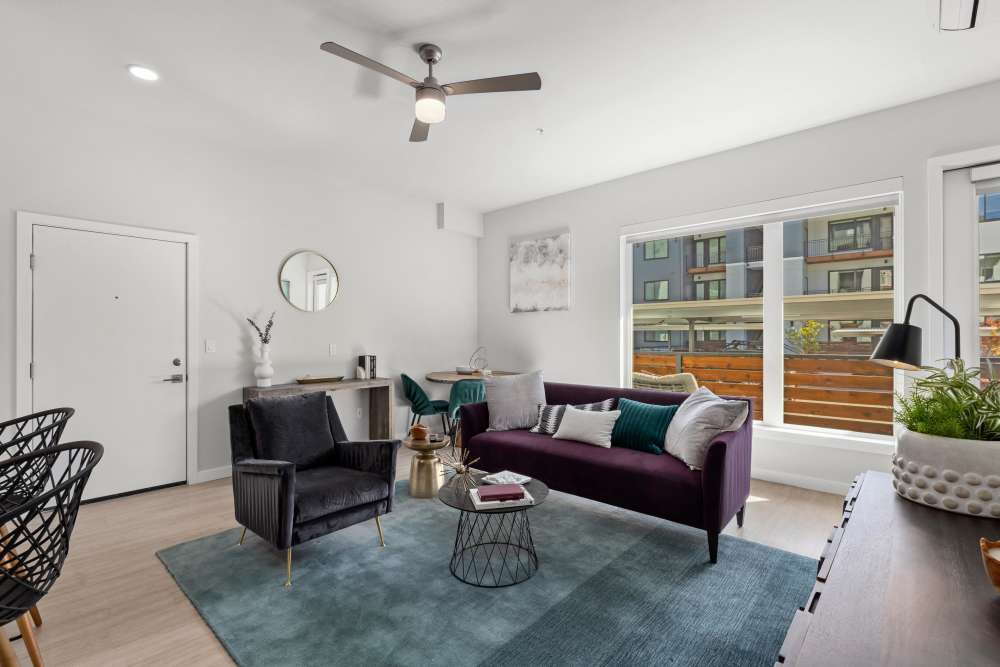 Living room with patio access at The Highlands at Silverdale in Silverdale, Washington