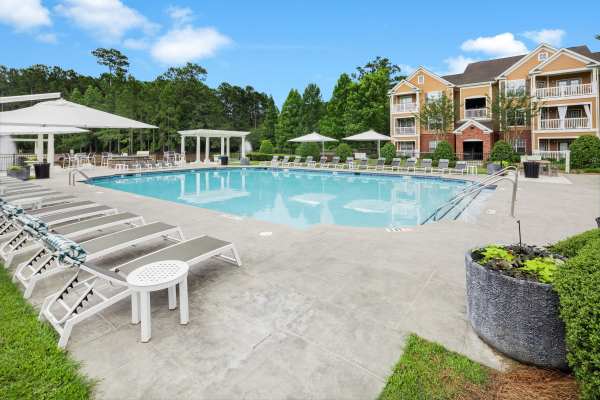Swimming pool with lounge beds at Bryant at Summerville in Summerville, South Carolina 