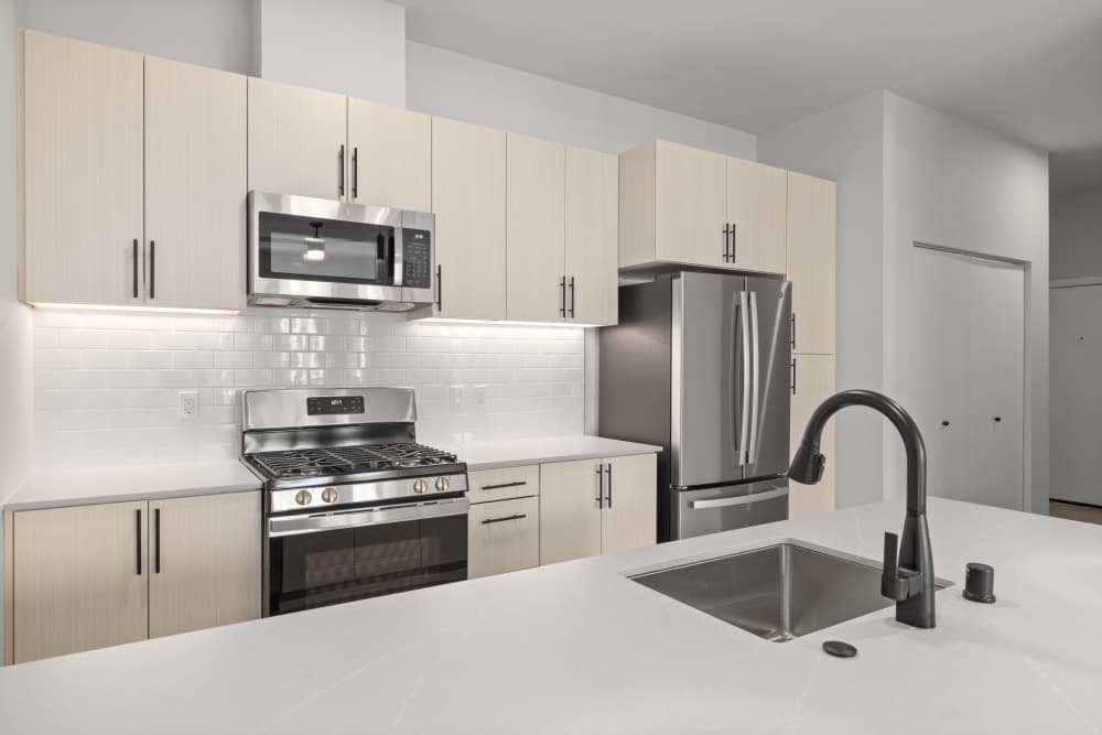 Kitchen with waterfall sink at The Highlands at Silverdale in Silverdale, Washington
