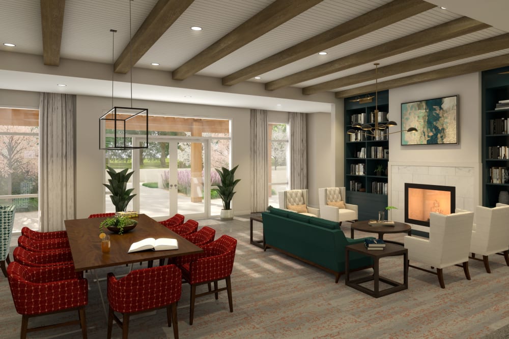 Elegant lounge seating with library bookcases at Anthology of Natick in Natick, Massachusetts