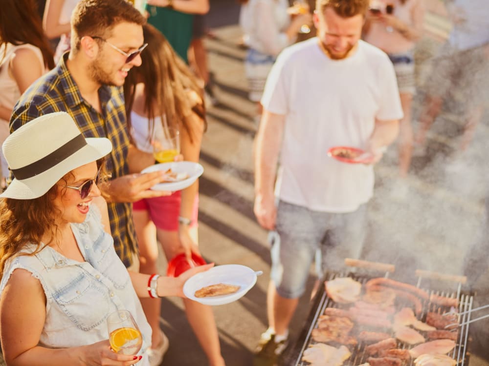 Friends barbecuing together near Banyan on Washington in Phoenix, Arizona