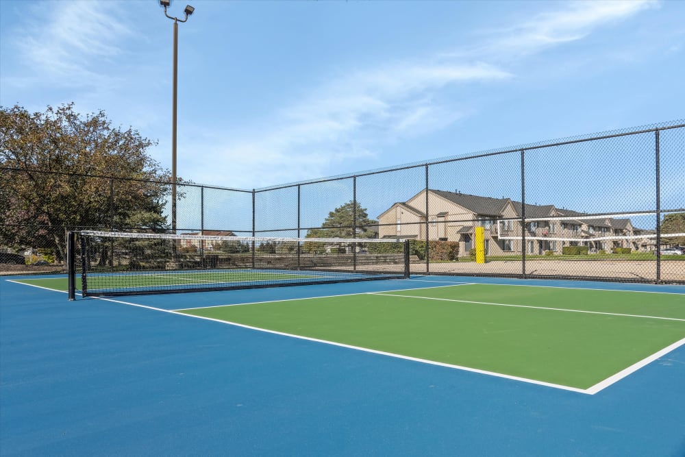 Illuminated tennis courts on the grounds at Lakeside Terraces in Sterling Heights, Michigan