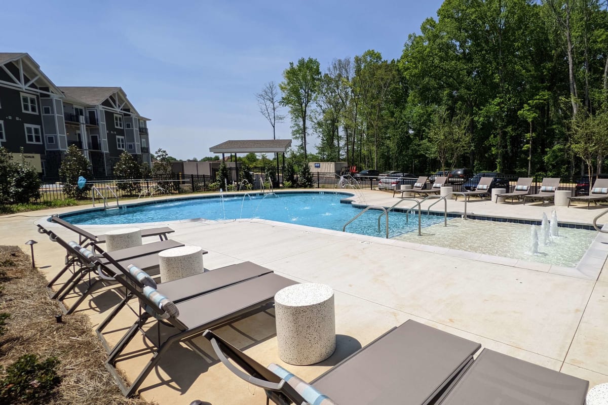 A shared living room space at Monark Grove Madison in Madison, Alabama