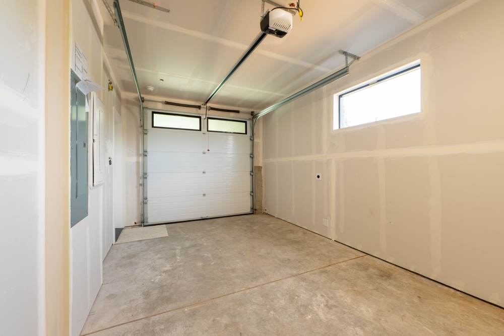 Empty garage with concrete flooring at Tuscany Woods in Marysville, Washington