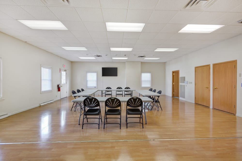 A clubhouse with activity space at Rochester Highlands in Rochester, New York