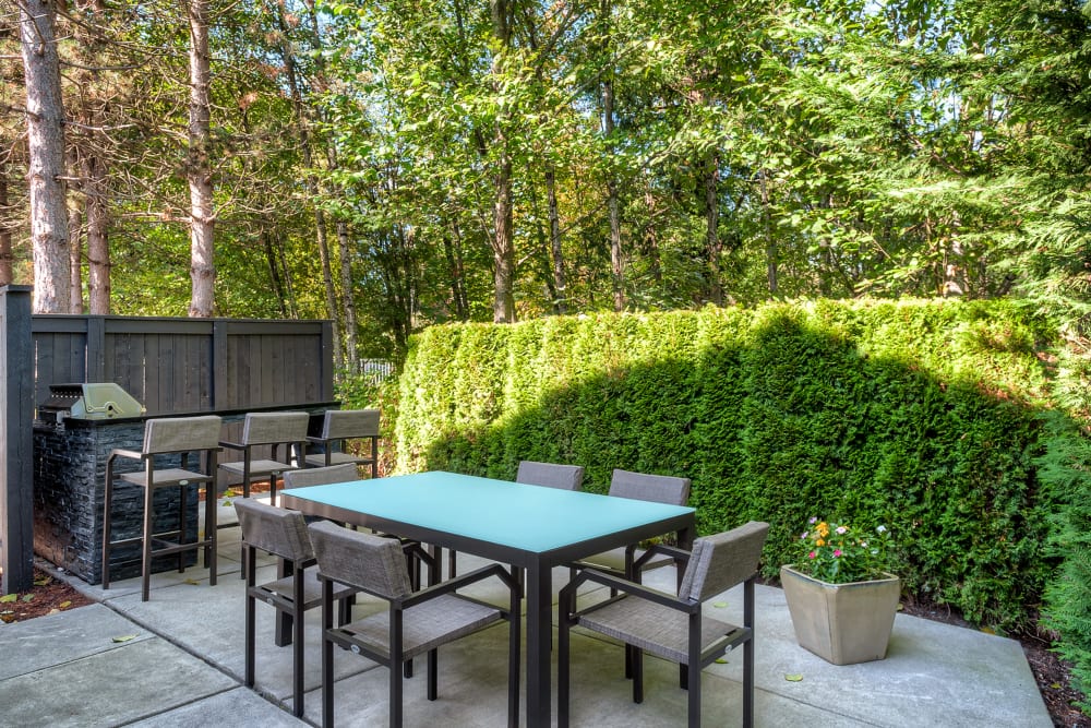 A BBQ lounge area at Karbon Apartments in Newcastle, Washington