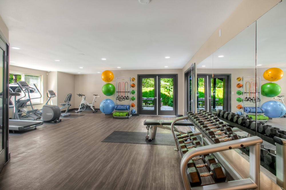 The spacious fitness center at Karbon Apartments in Newcastle, Washington