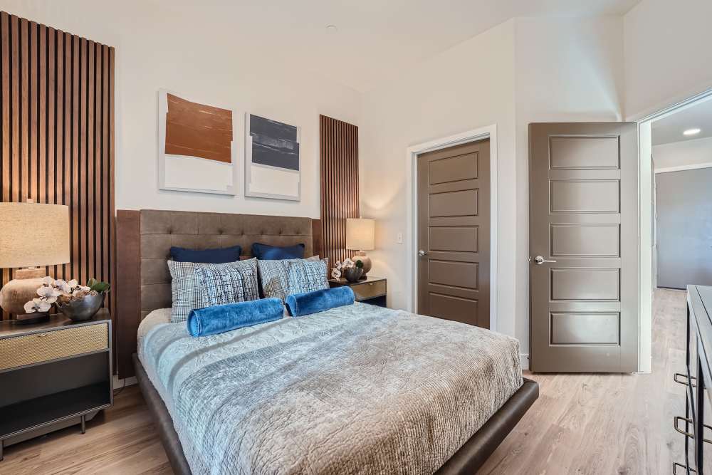 Spacious bedroom with hard-wood flooring at Flats on the A in Aurora, Colorado