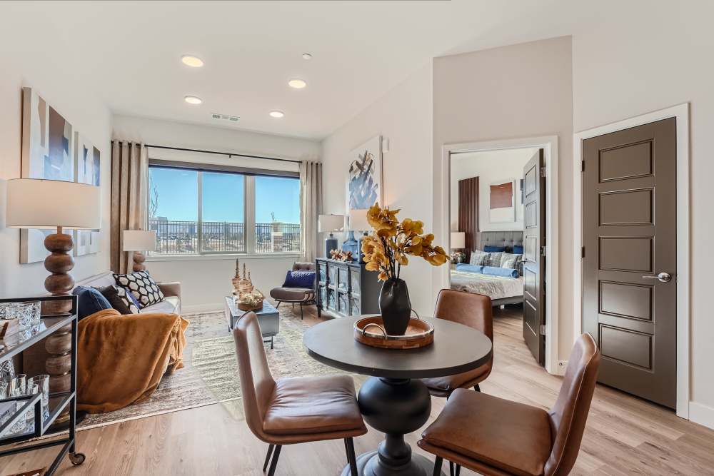 Round dining table with three chairs at Flats on the A in Aurora, Colorado