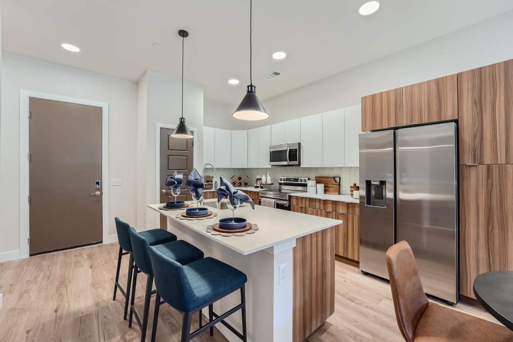 Fully equipped kitchen with steel appliances at Flats on the A in Aurora, Colorado