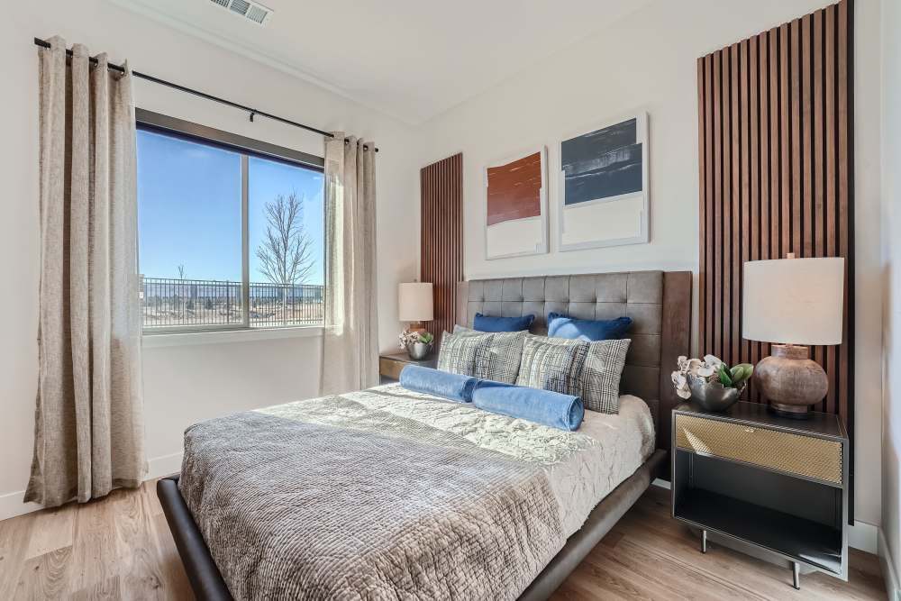 Spacious bedroom with window at Flats on the A in Aurora, Colorado