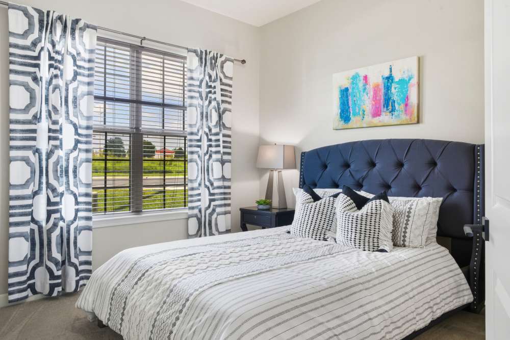 Modern bedroom at Boulders at Overland Park Apartments in Overland Park, KS