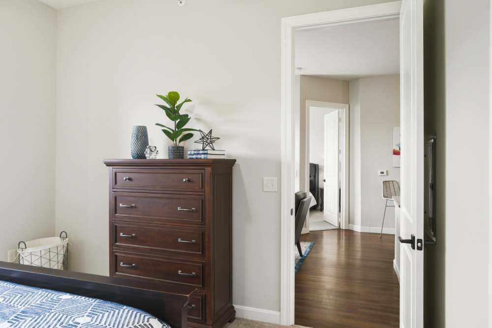 Bedroom with dresser at Boulders at Overland Park Apartments in Overland Park, KS