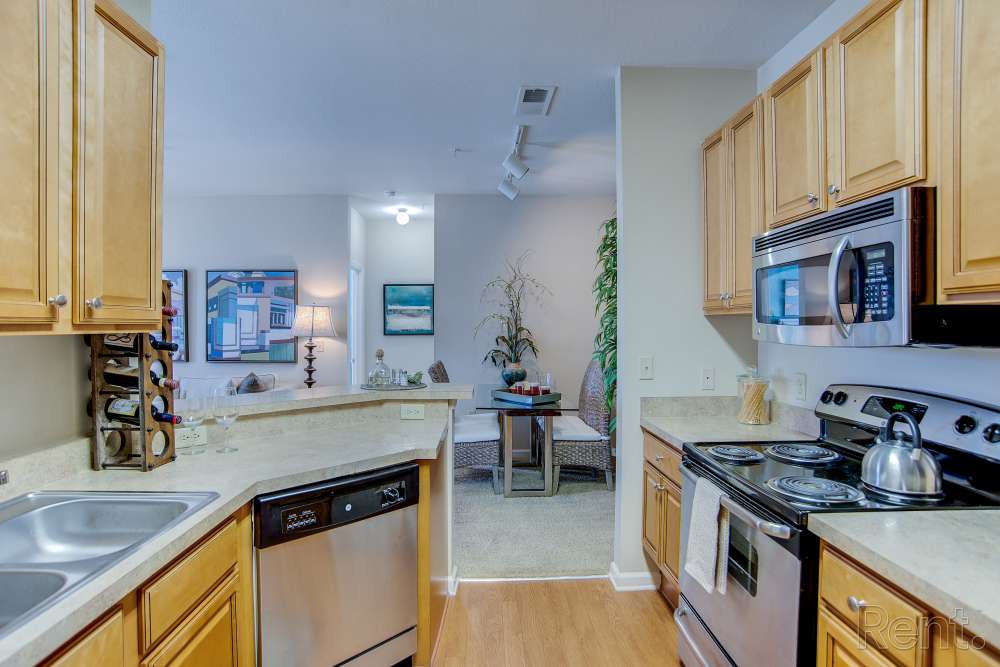 Bright kitchen with microwave at Highland Hills Apartments in Dothan, Alabama