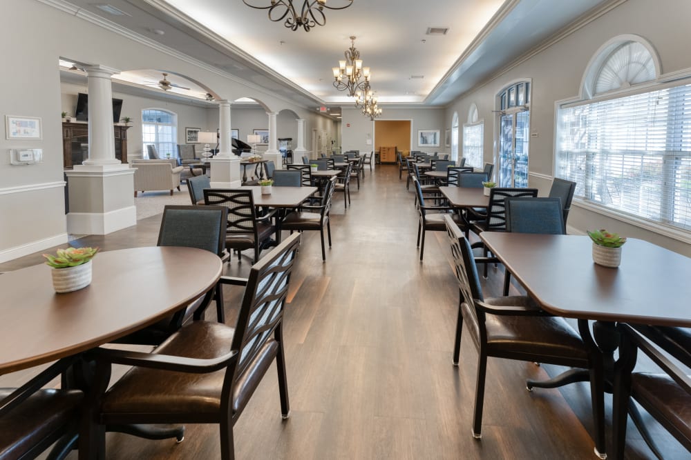 Dining room with hardwood floors at Addington Place of Lee's Summit in Lees Summit, Missouri