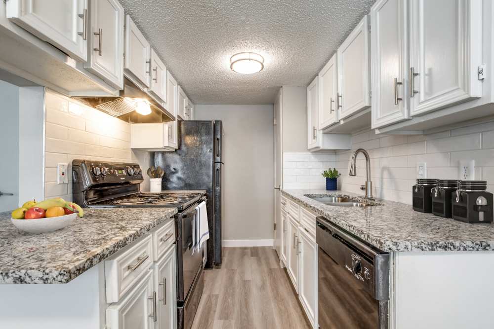Kitchen with white cabinety at Villa De Oro in San Antonio, Texas