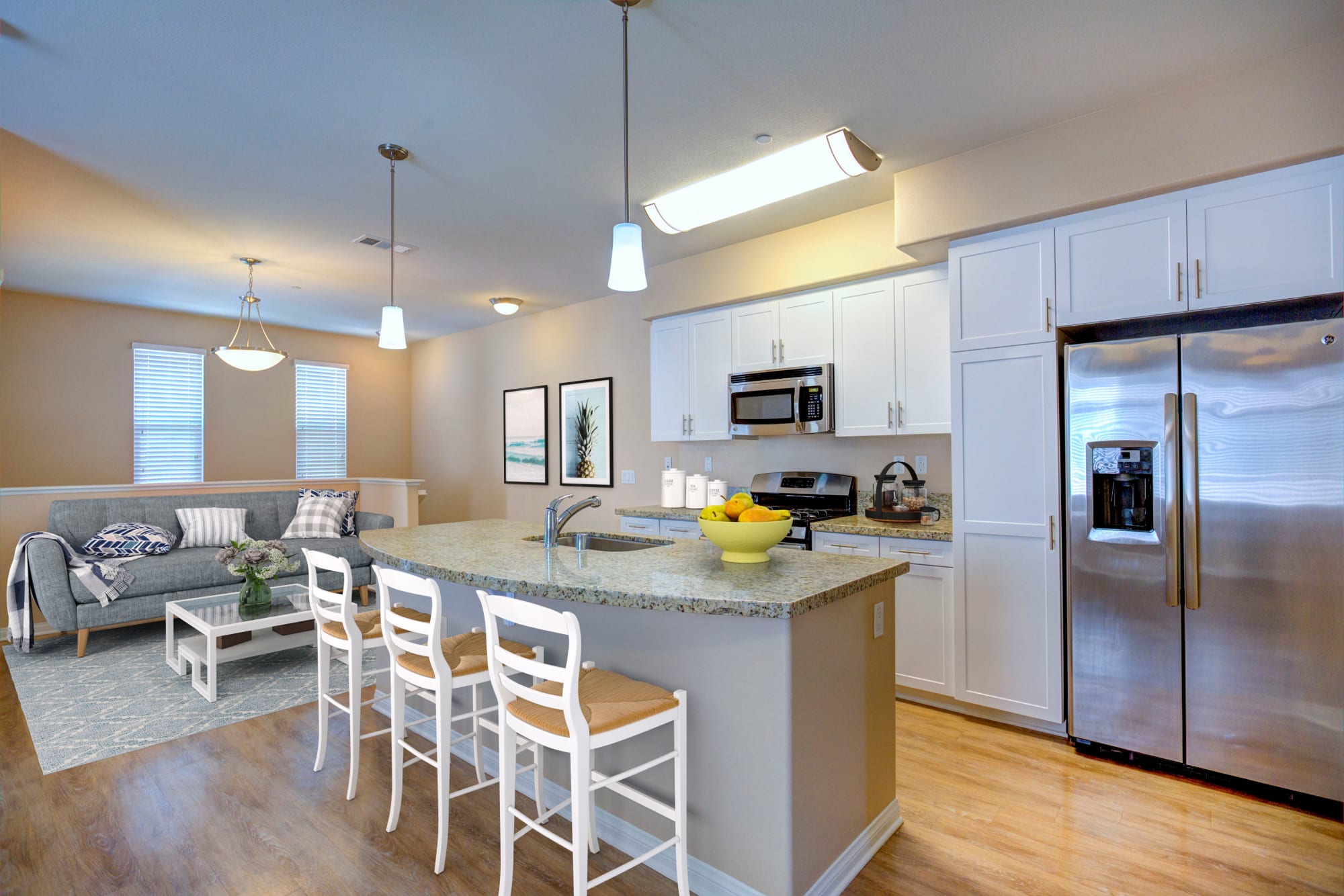 A kitchen, with open floor plan at Palisades Sierra Del Oro in Corona, California