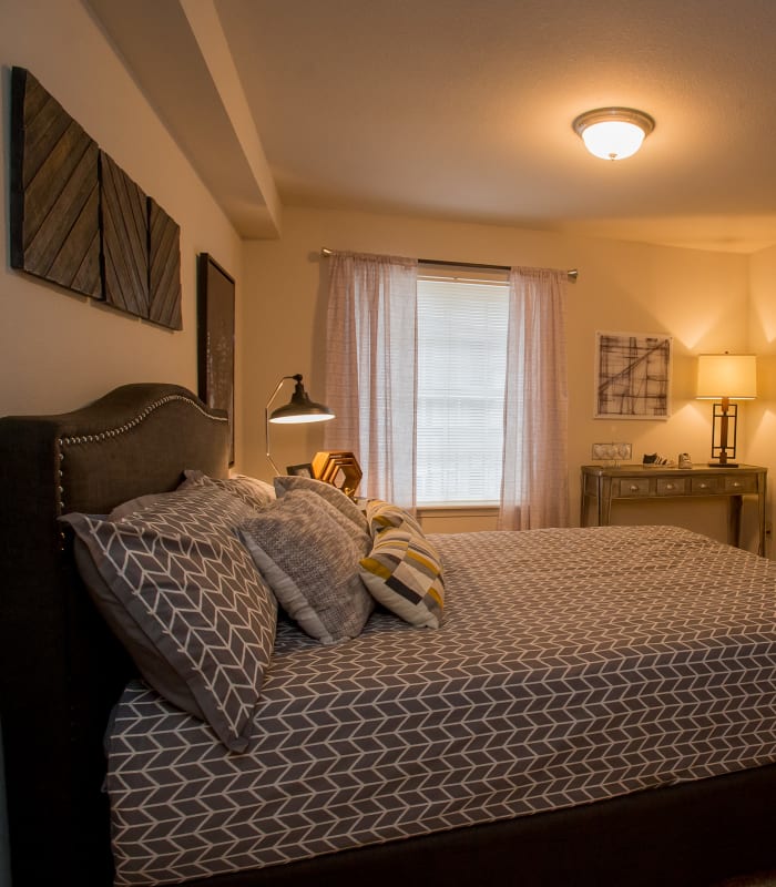 Chic bedroom with ceiling fan at Villas of Waterford Apartments in Wichita, Kansas