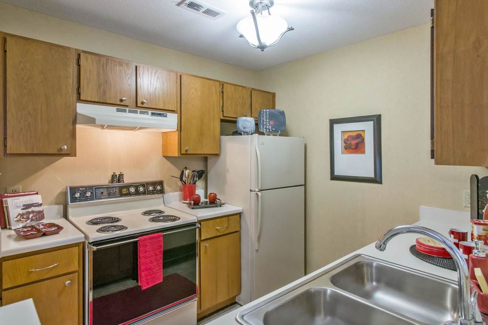 Kitchen with wooden cabinets at Marks Church Commons in Augusta, Georgia