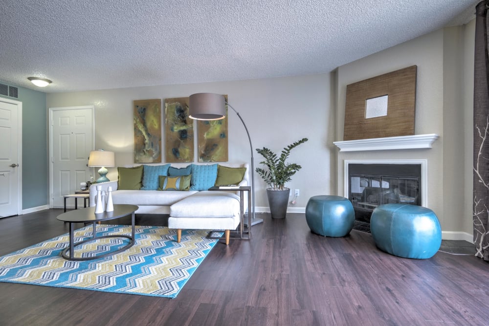 Spacious living room with hardwood-style floors at Arapahoe Club Apartments in Denver, Colorado